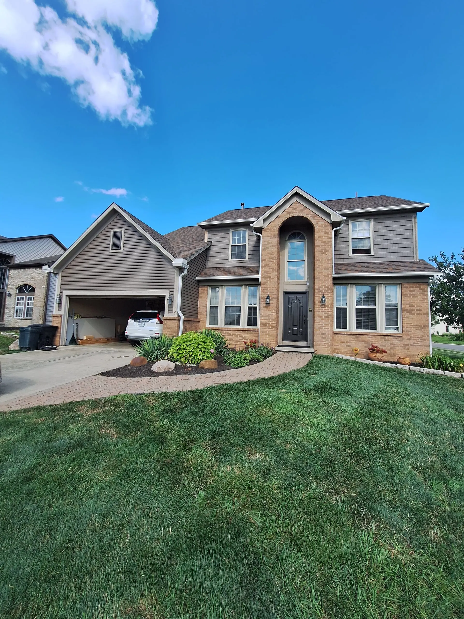 Two-story home exterior painting in Central Ohio